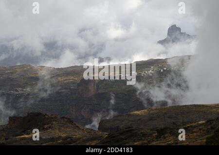 Village of El Toscon and Roque Bentaiga in the background. The Nublo Rural Park. Tejeda. Gran Canaria. Canary Islands. Spain. Stock Photo