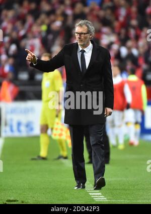 Chelsea head coach Antonio Conte holds the trophy after winning the ...