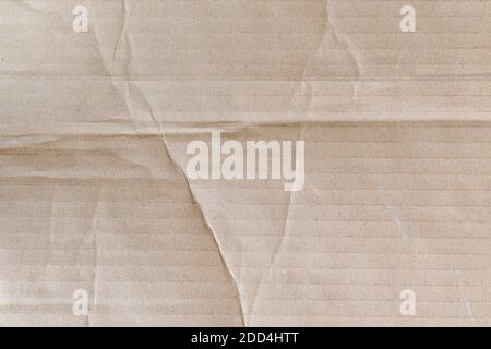 Brown cardboard paper texture as background. Old paper box surface pattern. Stock Photo