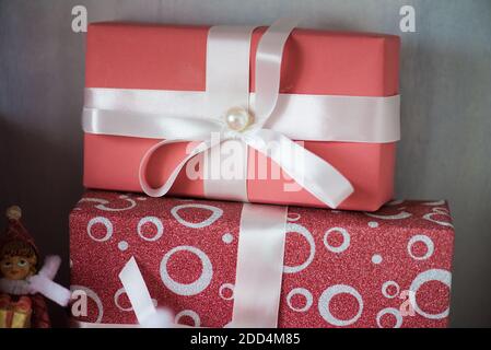 holyday gifts pink boxes with white bow macro close up Stock Photo