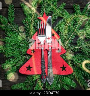 Christmas table place setting with Christmas decorations, top view with copy space. Winter Holidays background. Stock Photo