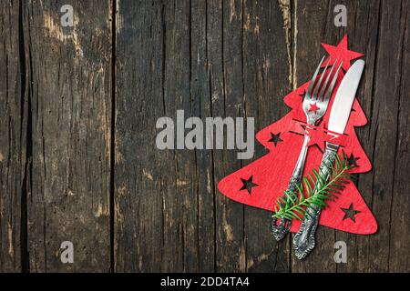 Christmas table place setting with Christmas decorations, top view with copy space. Winter Holidays background. Stock Photo
