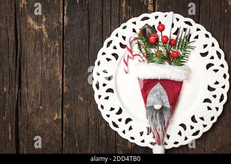 Christmas table place setting with Christmas decorations, top view with copy space. Winter Holidays background. Stock Photo