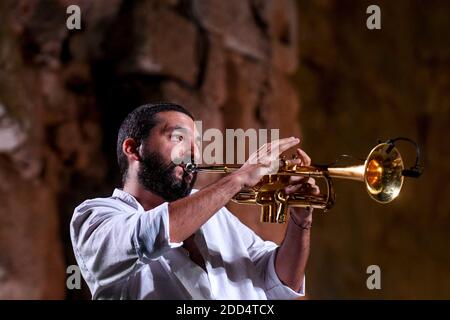 French trumpet player Ibrahim Maalouf seen on the steps of the temple of Bacchus in the ancient city of Baalbeck, east of Beirut, Lebanon, on August 4, 2018, during 'M' or Matthieu Chedid's concert as part of the summer yearly festival held in the Roman ruins. Both Chedid and Maalouf family roots come from Lebanon and this was their first concert together there. Photo by Ammar Abd Rabbo/ABACAPRESS.COM Stock Photo