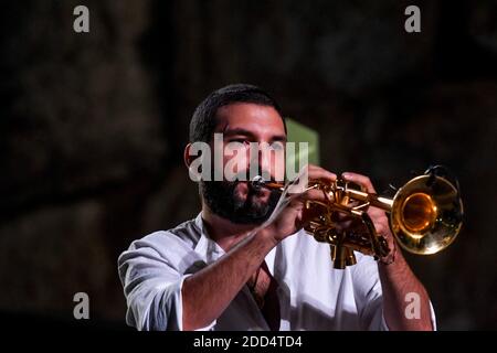 French trumpet player Ibrahim Maalouf seen on the steps of the temple of Bacchus in the ancient city of Baalbeck, east of Beirut, Lebanon, on August 4, 2018, during 'M' or Matthieu Chedid's concert as part of the summer yearly festival held in the Roman ruins. Both Chedid and Maalouf family roots come from Lebanon and this was their first concert together there. Photo by Ammar Abd Rabbo/ABACAPRESS.COM Stock Photo