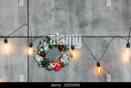 Christmas handmade wreath on a dark gray concrete background Stock Photo
