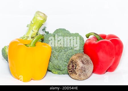 Broccoli and different seasonal vegetables isolated on white background Stock Photo