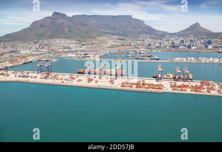 Cape Town, Western Cape / South Africa - 10/26/2020: Aerial photo of Cape Town Harbour and Container Terminal with Table Mountain and Lions Head in th Stock Photo