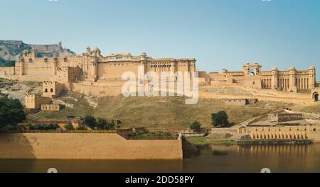 Amer Fort bathed in morning sunlight under blue sky in summer near Jaipur, Rajasthan, India. Stock Photo