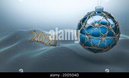 One blue Christmas ball enclosed with gold ornaments hanging over snow ground. Year number 2021 made of gold standing on the snow in the background. Stock Photo