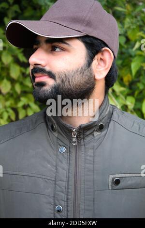 Portrait of a young and handsome military man in a forest Stock Photo