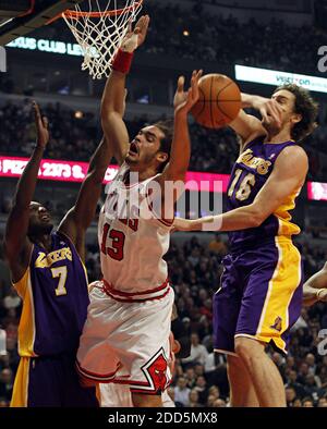 NO FILM, NO VIDEO, NO TV, NO DOCUMENTARY - Chicago Bulls' Joakim Noah (13) has his shot blocked by Los Angeles Lakers' Pau Gasol (16) with helpf from Lamar Odom (7) during the NBA Basketball match, Chicago Bulls vs Los Angeles Lakers at the United Center in Chicago, IL, USA on December 10, 2010. The Bulls defeated the Lakers, 88-84. Photo by Brian Cassella/Chicago Tribune/MCT/ABACAPRESS.COM Stock Photo