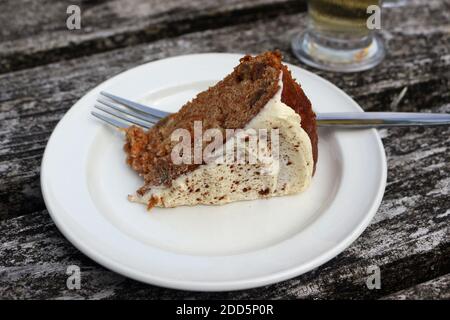 A piece of carrot cake on a white plate Stock Photo