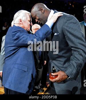 NO FILM, NO VIDEO, NO TV, NO DOCUMENTARY - Former North Carolina coach Dean Smith congratulates Charlotte Bobcats majority owner, and former player, Michael Jordan after Jordan was inducted into the North Carolina Sports Hall of Fame at halftime of the NBA Basketball match, Bobcats vs Toronto Raptors at the Time Warner Cable Arena in Charlotte, NC, USA on December 14, 2010. Photo by David T. Foster III/Charlotte Observer/MCT/ABACAPRESS.COM Stock Photo