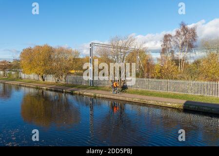 Cyclist on the Birmingham Canal Old Line towpath in Ladywood close to Birmingham city centre Stock Photo