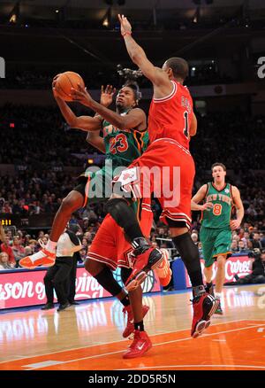 NO FILM, NO VIDEO, NO TV, NO DOCUMENTARY - New York Knicks point guard Toney Douglas (23) drives to the basket against Chicago Bulls point guard Derrick Rose (1) in the first half during the NBA Basketball match, New York Knicks vs Chicago Bulls at Madison Square Garden in New York City, NY, USA on December 25, 2010. The Knicks defeated the Bulls 103-95. Photo by Christopher Pasatieri/Newsday/MCT/ABACAPRESS.COM Stock Photo