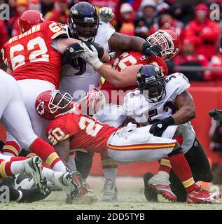 NO FILM, NO VIDEO, NO TV, NO DOCUMENTARY - Baltimore Ravens linebacker Ray Lewis (52) wrapped up Kansas City Chiefs running back Thomas Jones (20) at the line of scrimmage, as Baltimore Ravens defensive tackle Brandon McKinney (91) fought off blocks by Kansas City Chiefs center Casey Wiegmann (62) and Kansas City Chiefs guard Ryan Lilja (65) during the NFL match, Kansas City Chiefs vs Baltimore Ravens at Arrowhead Stadium in Kansas City, MO, USA on January 9, 2011. The Ravens defeated the Chiefs, 30-7. Photo by Shane Keyser/Kansas City Star/MCT/ABACAPRESS.COM Stock Photo