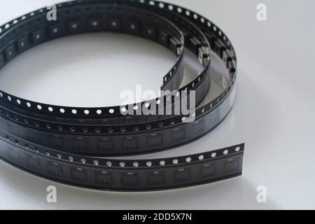 Electronic component on white background. SMD components in black plastic carrier tape with copy-space Stock Photo