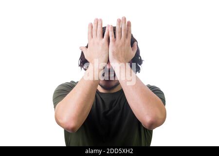 Portrait of angry and disappointed young man, facepalm gesture clenching teeth, covers face with his hands. Depressed person suffering emotional break Stock Photo