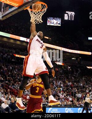 NO FILM, NO VIDEO, NO TV, NO DOCUMENTARY - Miami Heat's Dwyane Wade dunks the ball against the Cleveland Cavaliers in the second quarter during the NBA Basketball match, Cleveland Cavaliers vs Miami Heat at AmericanAirlines Arena in Miami, FL, USA on January 31, 2011. The Heat won, 117-90. Photo by Hector Gabino/El Nuevo Herald/MCT/ABACAPRESS.COM Stock Photo