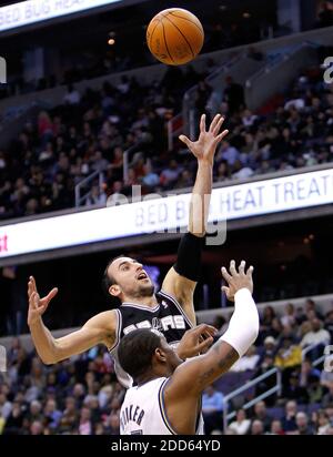 NO FILM, NO VIDEO, NO TV, NO DOCUMENTARY - San Antonio Spurs shooting guard Manu Ginobili (20) shoots over Washington Wizards center Trevor Booker (35) during NBA Basketball match, Washington Wizards vs San Antonio Spurs at the Verizon Center in Washington, USA on February 12, 2011. San Antonio Spurs won 118-94. Photo by Harry E. Walker/MCT/ABACAPRESS.COM Stock Photo