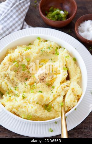 Homemade mashed potatoes with melting butter and fresh herbs Stock Photo