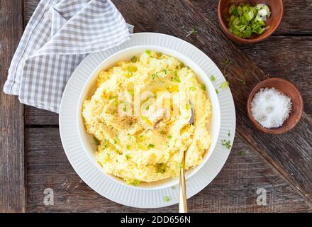 Homemade mashed potatoes with melting butter and fresh herbs Stock Photo