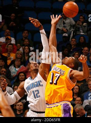 NO FILM, NO VIDEO, NO TV, NO DOCUMENTARY - Orlando Magic center Dwight Howard (12) and Los Angeles Lakers center Andrew Bynum (17) battle for a rebound during the NBA Basketball match, Los Angeles Lakers vs Orlando Magic at the Amway Center in Orlando, FL, USA on February 13, 2011. Orlando won the game 89-75. Photo by Stephen M. Dowell/Orlando Sentinel/MCT/ABACAPRESS.COM Stock Photo