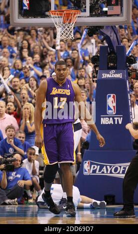 NO FILM, NO VIDEO, NO TV, NO DOCUMENTARY - Los Angeles Lakers center Andrew Bynum (17) knocked Dallas Mavericks point guard Jose Juan Barea (11) down hard in the 4th period during Game 4 of the NBA Western Conference Playoffs at the American Airlines Center, Sunday, May 8, 2011 in Dallas, Texas. The Dallas Mavericks defeated the Los Angeles Lakers, 122-86. (Paul Moseley/Fort Worth Star-Telegram/MCT) Stock Photo