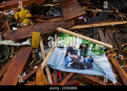 NO FILM, NO VIDEO, NO TV, NO DOCUMENTARY - The engagement portrait of Jarod Stice, left, and Jessica Bennett lay in the ruins of their home in Joplin, Missouri, on Monday morning, May 23, 2011, following the destruction of a tornado that swept through the heart of Joplin Sunday evening. The couple found their wedding rings in the ruins and is still planning to wed on July 23rd. Photo by David Eulitt/Kansas City Star/MCT/ABACAPRESS.COM Stock Photo