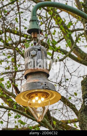 Close-up of an old Berlin street lamp that still runs on gas. Stock Photo