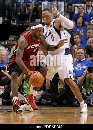 The Mavericks' Shawn Marion drives against the Heat's Mike Miller in ...