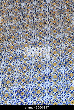 Repeated pattern of traditional Portuguese azulejo tiles - blue, yellow and white