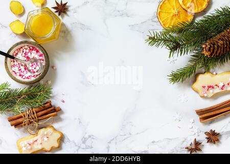 The gingerbread Christmas baking seasoning is honey, cinnamon, anise and ginger on a marble countertop. Seasonal, food background. Flat top view. Copy Stock Photo