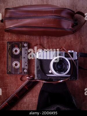 leather men's pouch old cassette vintage camera flat lay Stock Photo