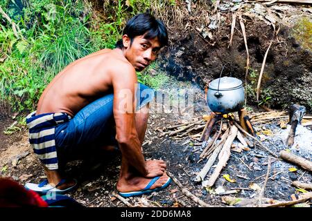 Guide Preparing Lunch on the First Day of the Three Day Trek up Mount Rinjani, Lombok, Indonesia, Asia Stock Photo