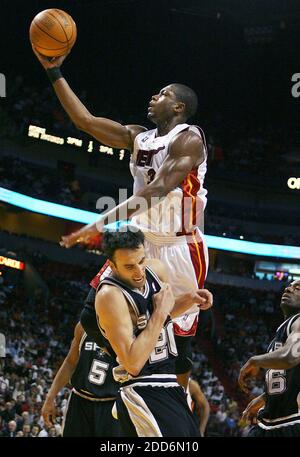 NO FILM, NO VIDEO, NO TV, NO DOCUMENTARY - Miami Heat's Dwyane Wade, top, drives against San Antonio Spurs' Manu Ginobili during the second quarter, at American Airlines Arena in Miami, FL, USA on February 11, 2007. The Heat defeated the Spurs 100-85. Photo by Jared Lazarus/Miami Herald/MCT/Cameleon/ABACAPRESS.COM Stock Photo