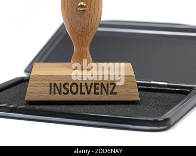 Wooden stamp with the imprint 'Insolvenz', translation 'insolvency' Stock Photo