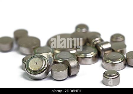 Various button cells against a white background Stock Photo