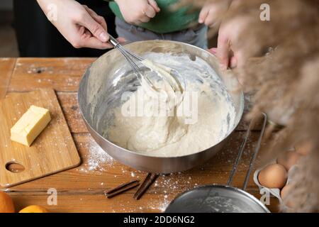 Women preparing homemade food pie, pizza, pasta with a dough roll. Hobbies and family life concept Stock Photo