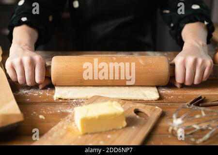 Women preparing homemade food pie, pizza, pasta with a dough roll. Hobbies and family life concept Stock Photo