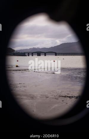 Barmouth Bridge (a wooden railway viaduct) seen through the fender of a boat, Barmouth Harbour, Gwynedd, North Wales, Wales, United Kingdom, Europe Stock Photo