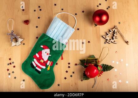 Concept Coronavirus and christmas on wooden background Stock Photo