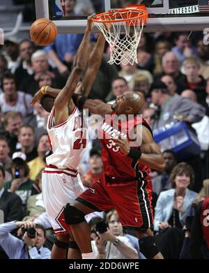 CHICAGO, IL - APRIL 24: Chicago Bulls forward Derrick Jones Jr. (5) drives  to the basket between two defenders Milwaukee Bucks forward Giannis  Antetokounmpo (34) and Milwaukee Bucks guard Pat Connaughton (24)