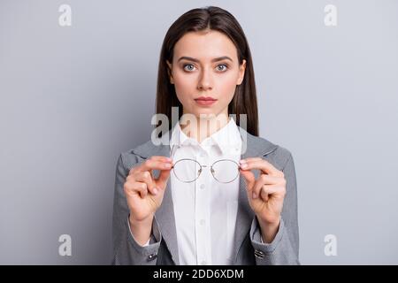 Photo of attractive business lady confident manager hold eye glasses have bad sight working with computer often need vision protection wear shirt Stock Photo