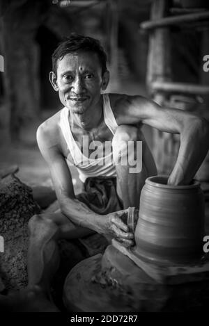 Portrait of a potter in an Oh Bo pottery shed, Twante, near Yangon, Myanmar (Burma) Stock Photo
