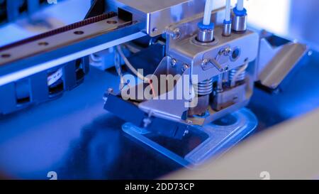 Three dimensional printing machine prints physical 3D model - close up Stock Photo
