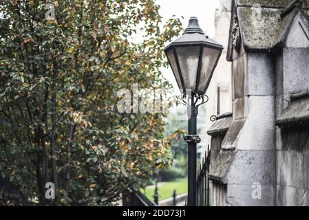 Old fashioned retro lamp post light in London showing architectural details of an old building near Borough Market, Southwark, London, England Stock Photo