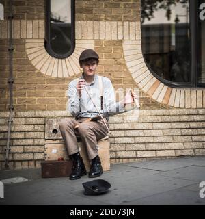 Street performer busking in Southwark, near Borough Market, Southwark, London, England Stock Photo