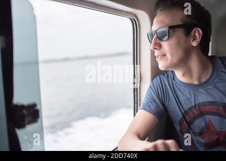 Tourist on the boat from Banda Aceh to Pulau Weh Island, Aceh Province, Sumatra, Indonesia, Asia Stock Photo